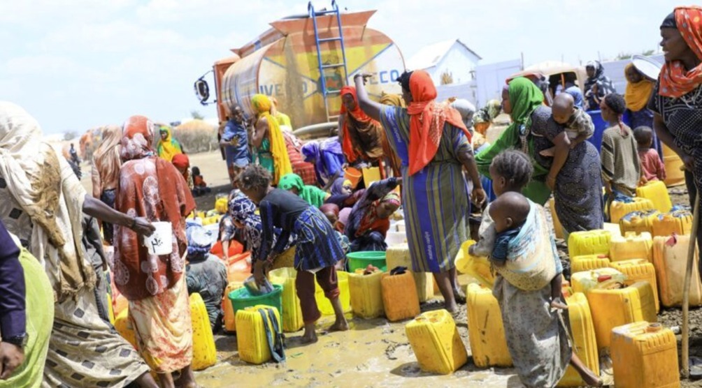 Communities accessing clean water during humanitarian WASH distribution